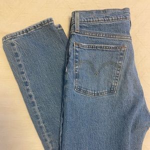 Distressed light wash Levi’s 501 bootcut